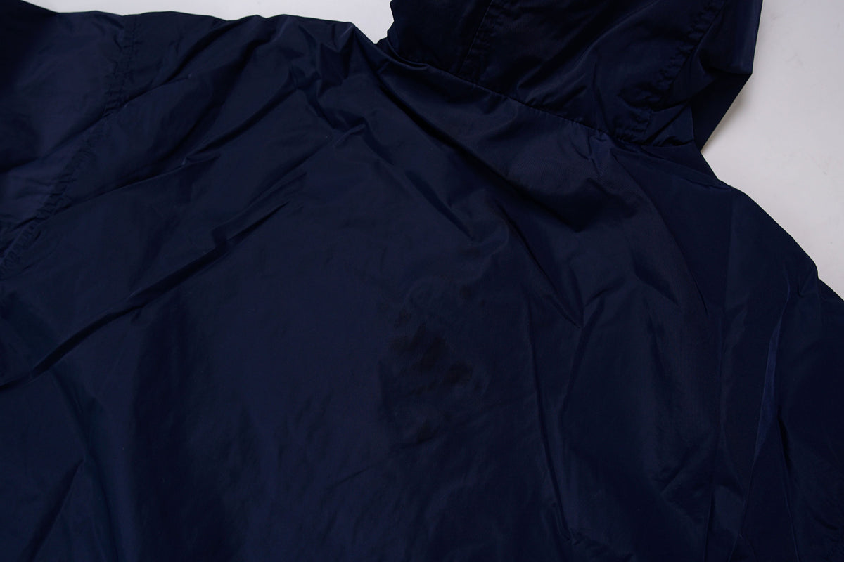 Nike jacket in dark blue and black with hood and white contrast stripes across the chest, back view