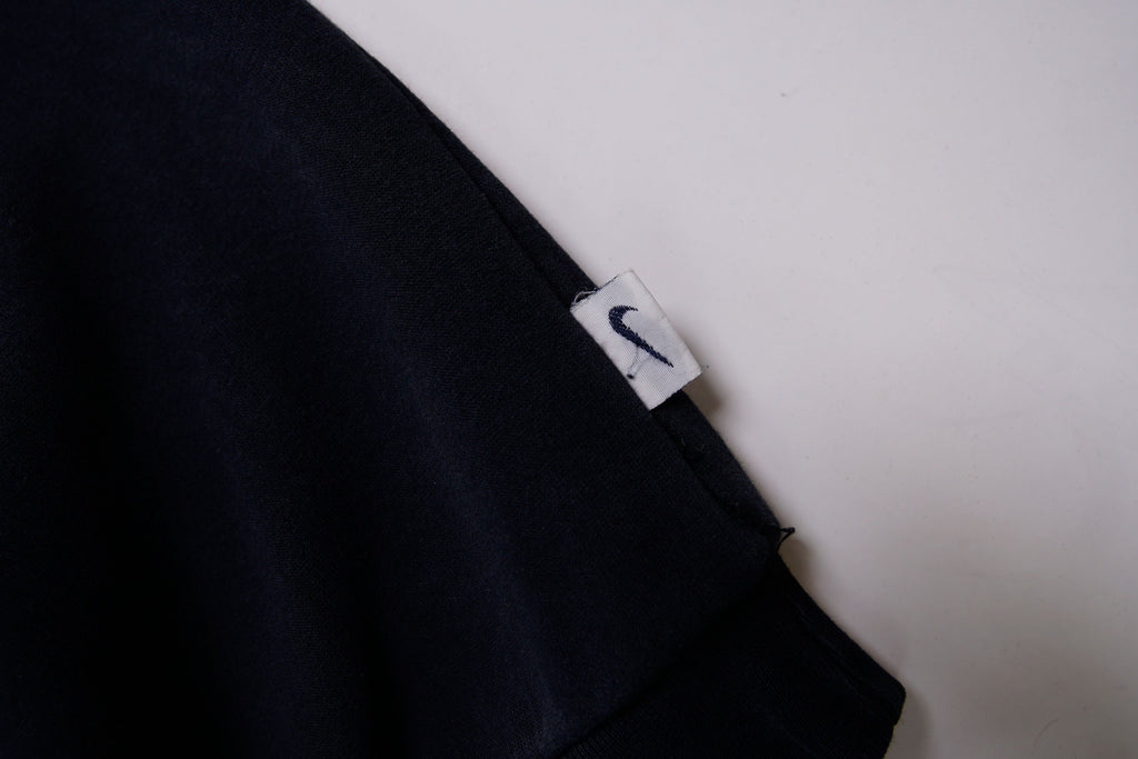 Black Nike sweater with embroidered white spellout logo and Swoosh on chest, detail 2