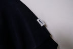 Black Nike sweater with embroidered white spellout logo and Swoosh on chest, detail 2