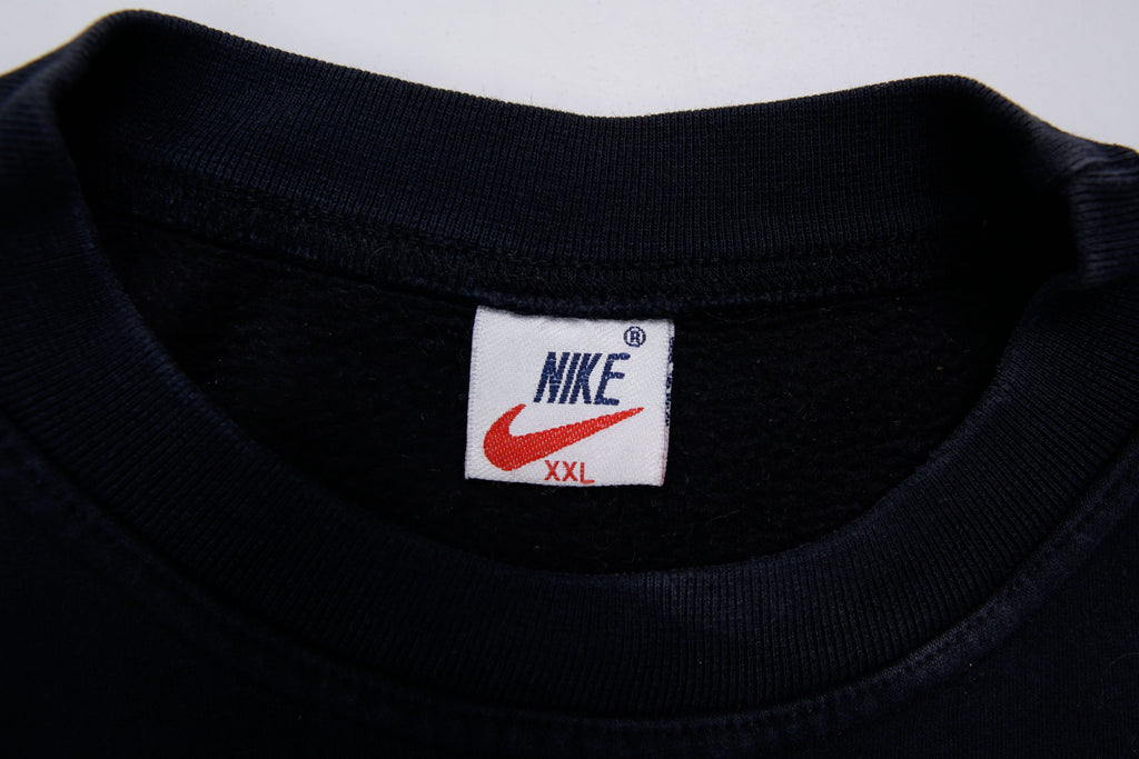 Black Nike sweater with embroidered white spellout logo and Swoosh on chest, size label