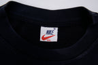 Black Nike sweater with embroidered white spellout logo and Swoosh on chest, size label