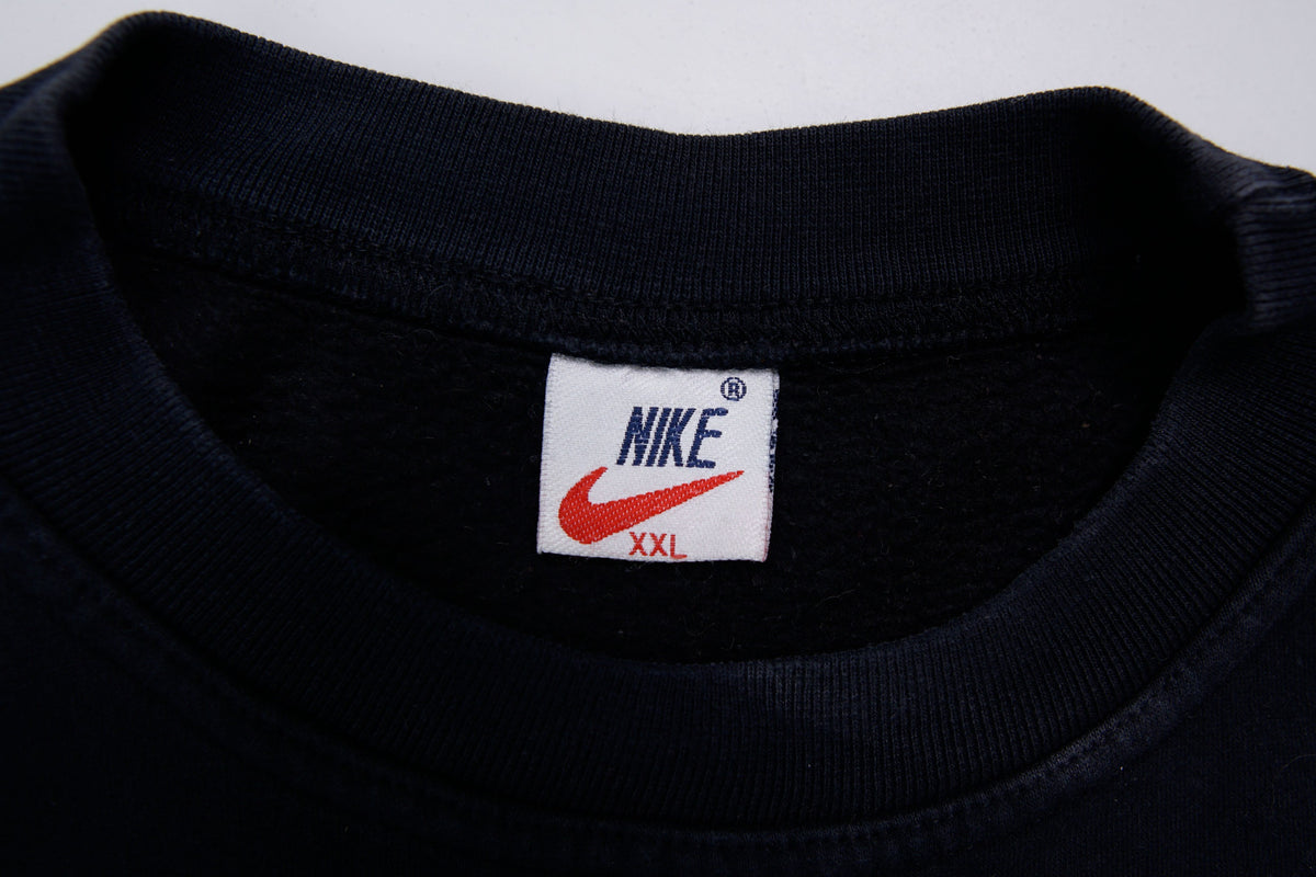 Black Nike sweater with embroidered white spellout logo and Swoosh on chest, size label