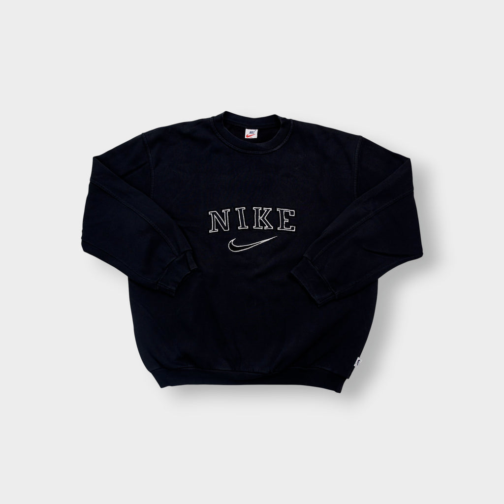 Black Nike sweater with embroidered white spellout logo and Swoosh on chest
