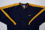 Nike navy and yellow V-neck sweater with yellow sleeve stripes and embroidered swoosh, full view