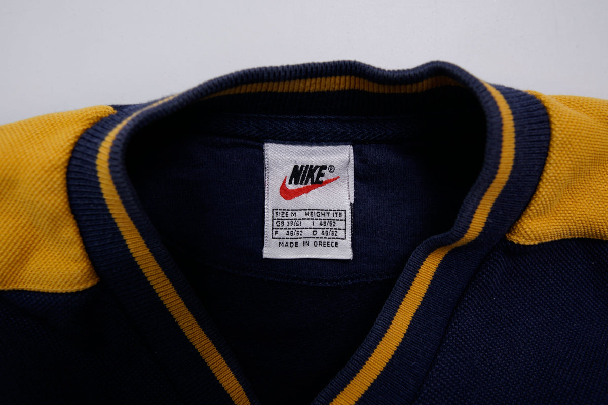 Nike navy and yellow V-neck sweater with yellow sleeve stripes and embroidered swoosh, size label