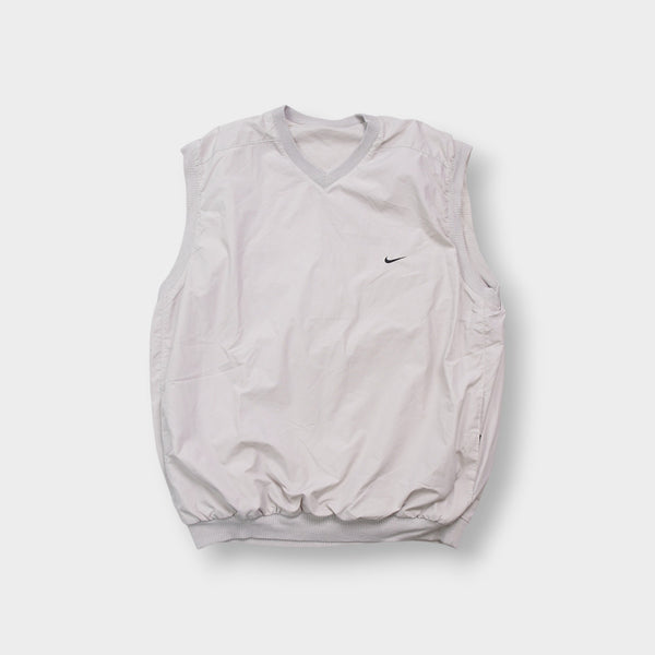 Grey Nike Golf sleeveless sweater vest featuring a black embroidered Swoosh logo