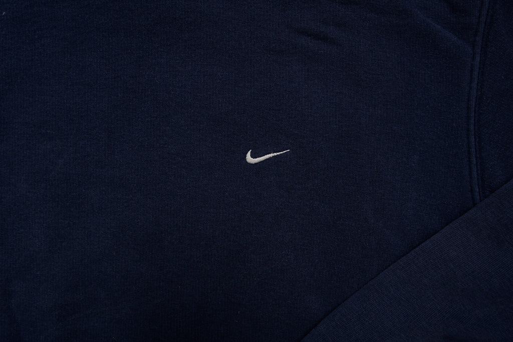 Nike hoodie sweater in navy with light blue hood lining and small embroidered Swoosh, detail