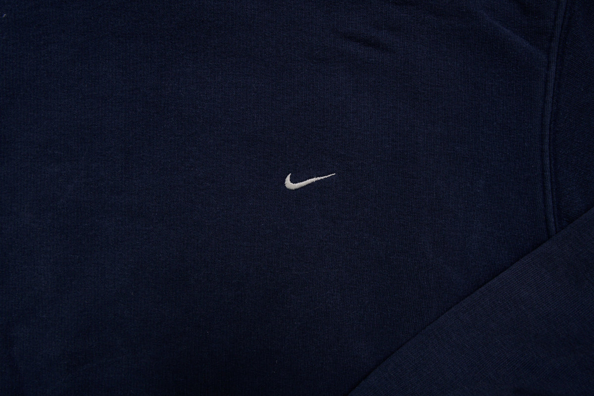 Nike hoodie sweater in navy with light blue hood lining and small embroidered Swoosh, detail