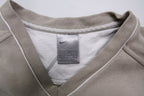 Nike sweater in beige with V-neck detailing and small script embroidery, size label