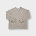 Nike sweater in beige with V-neck detailing and small script embroidery