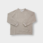 Nike sweater in beige with V-neck detailing and small script embroidery