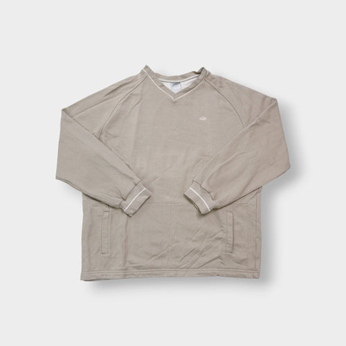 Nike sweater in beige with V-neck detailing and small script embroidery