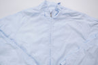Nike light baby blue zip jacket with small white embroidered swoosh on the chest, full view