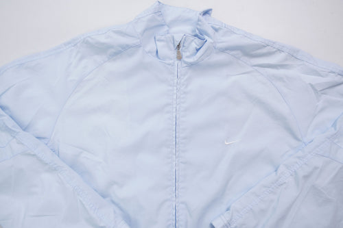 Nike light baby blue zip jacket with small white embroidered swoosh on the chest, full view