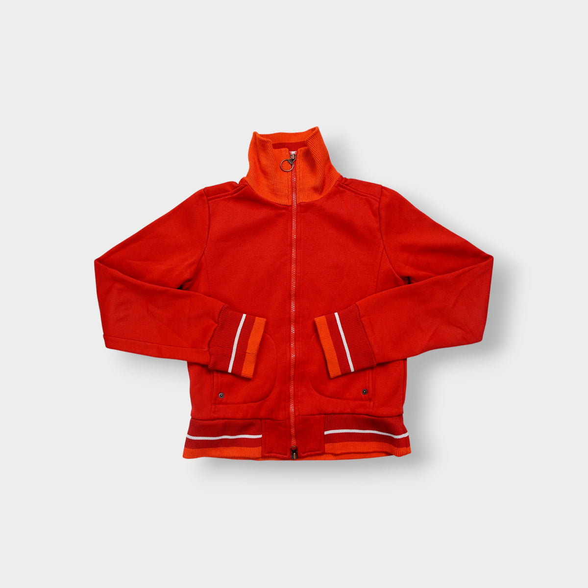 Nike track jacket in red and orange featuring a ring zipper pull and ribbed collar
