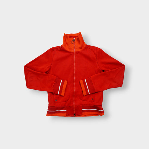 Nike track jacket in red and orange featuring a ring zipper pull and ribbed collar