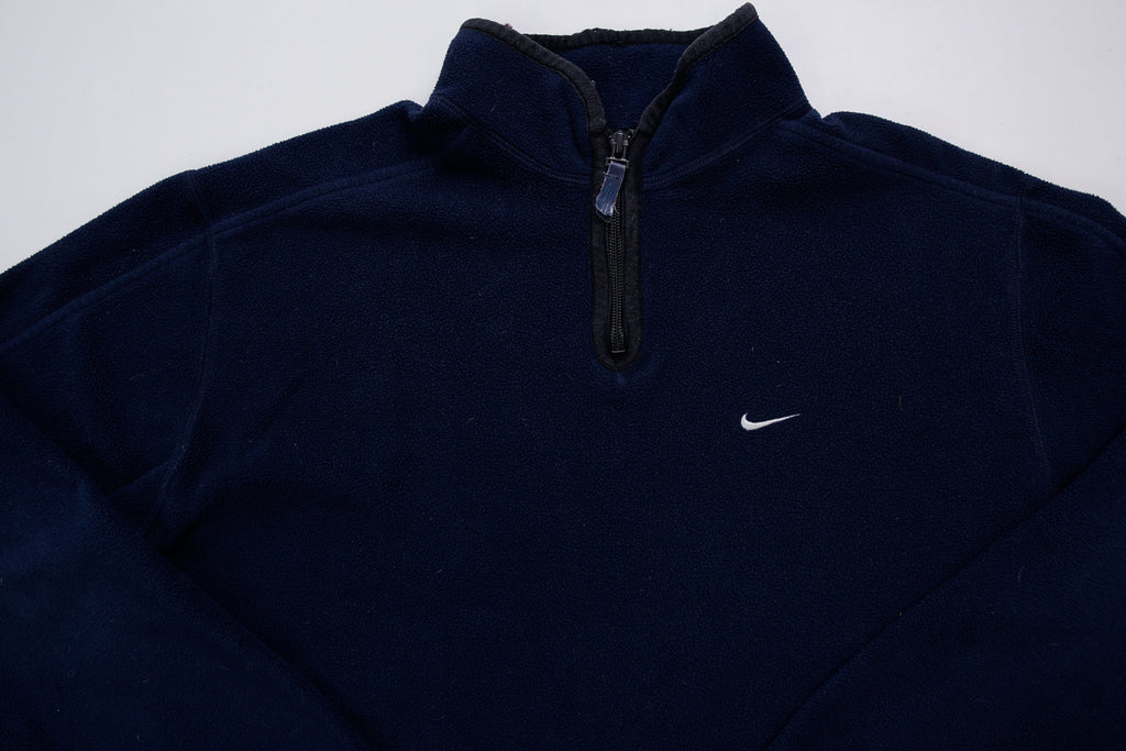 Nike fleece sweater in navy with a half-zip collar and white embroidered Swoosh, full view
