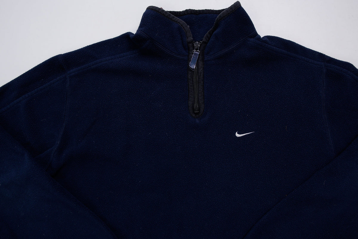 Nike fleece sweater in navy with a half-zip collar and white embroidered Swoosh, full view