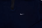 Nike fleece sweater in navy with a half-zip collar and white embroidered Swoosh, detail