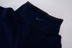 Nike fleece sweater in navy with a half-zip collar and white embroidered Swoosh, detail 3