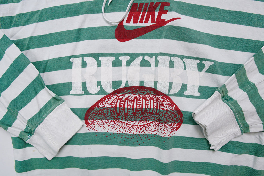 Nike green and white striped hooded sweater with a red rugby print on the chest, detail