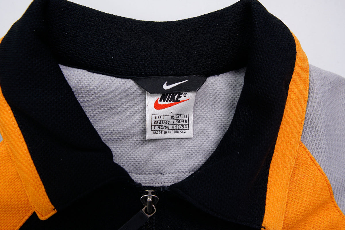 Nike short-sleeve jacket in black and grey with orange stripes and collar detail, size label