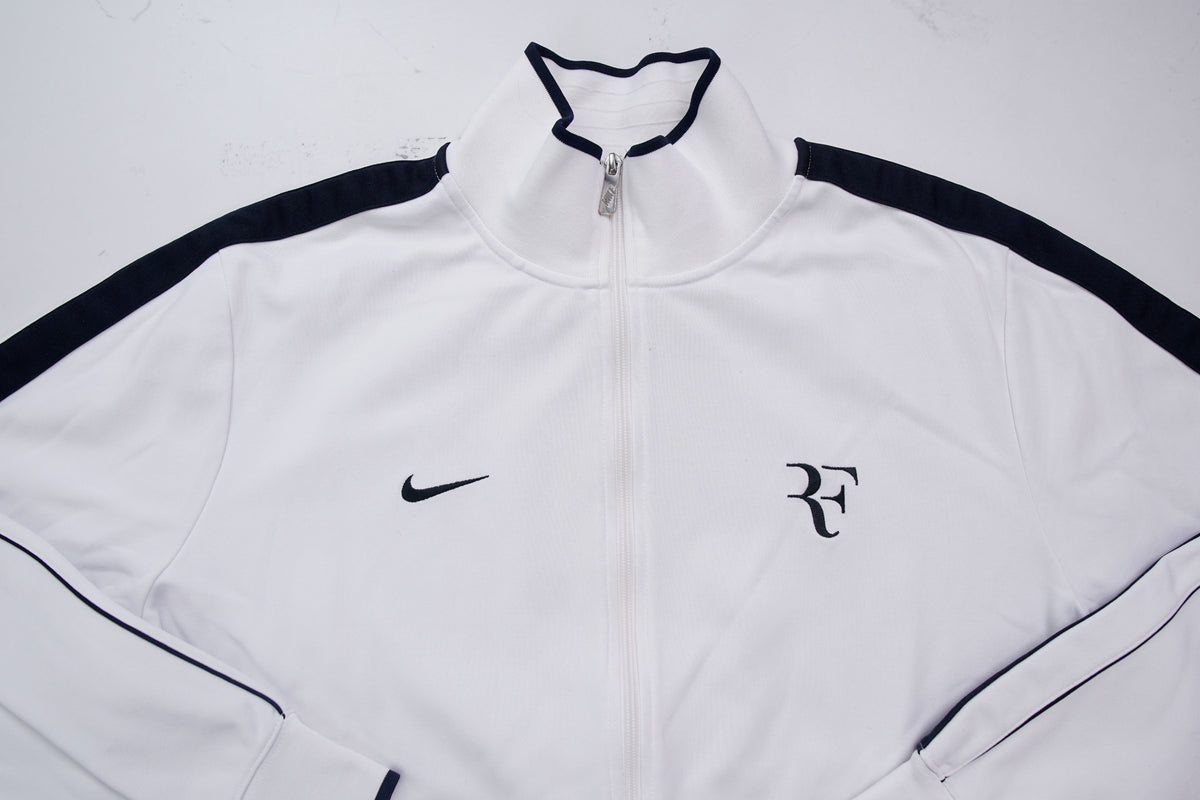 Nike track jacket in white and navy featuring an embroidered RF logo on the chest, full view