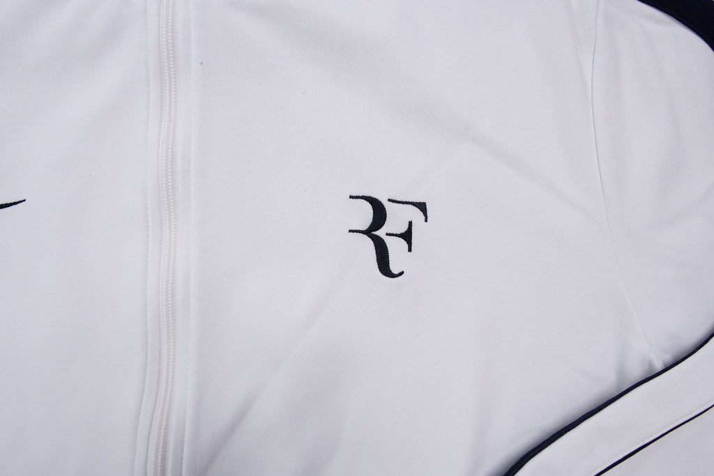 Nike track jacket in white and navy featuring an embroidered RF logo on the chest, detail