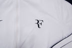 Nike track jacket in white and navy featuring an embroidered RF logo on the chest, detail