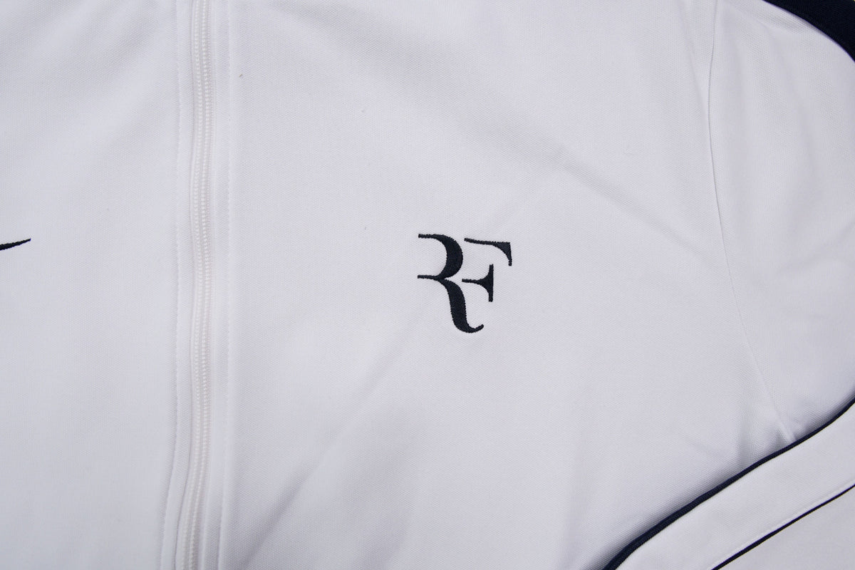 Nike track jacket in white and navy featuring an embroidered RF logo on the chest, detail