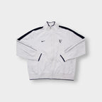 Nike track jacket in white and navy featuring an embroidered RF logo on the chest