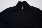 Nike track jacket in black featuring an embroidered swoosh logo on the chest, full view