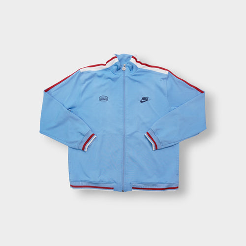 Light blue Nike jacket with red shoulder stripes and embroidered chest logo
