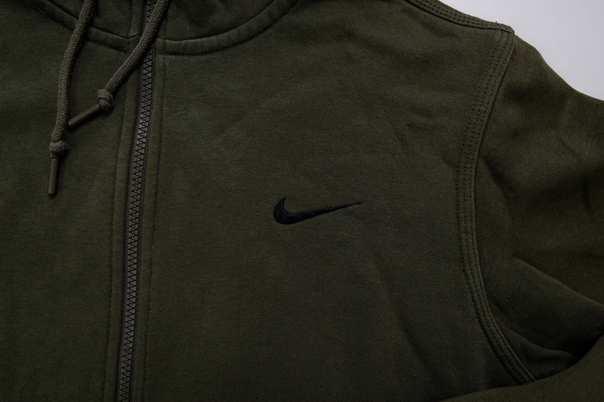 Green Nike zip hoodie jacket with a small black embroidered Swoosh on chest, detail