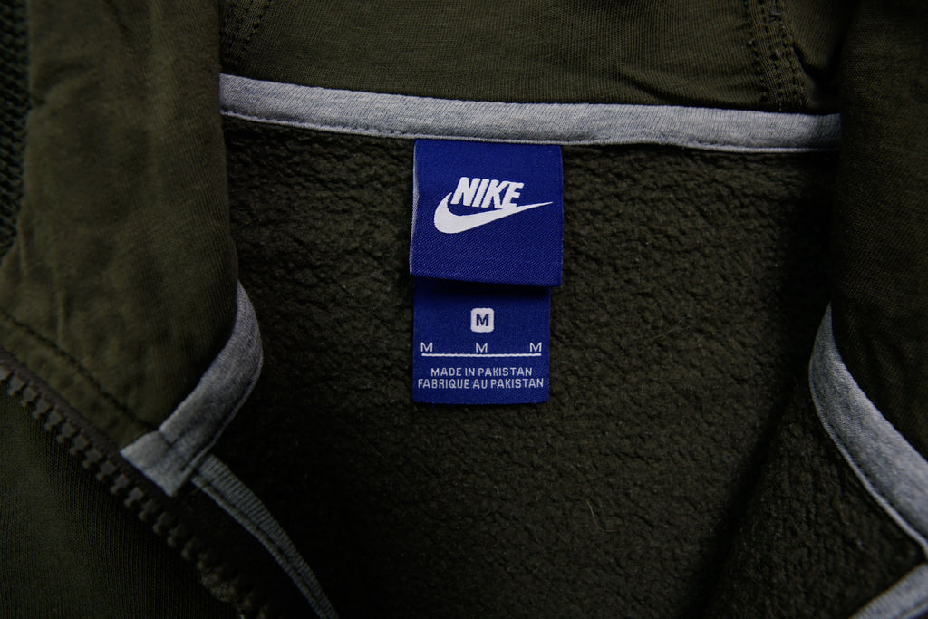 Green Nike zip hoodie jacket with a small black embroidered Swoosh on chest, size label