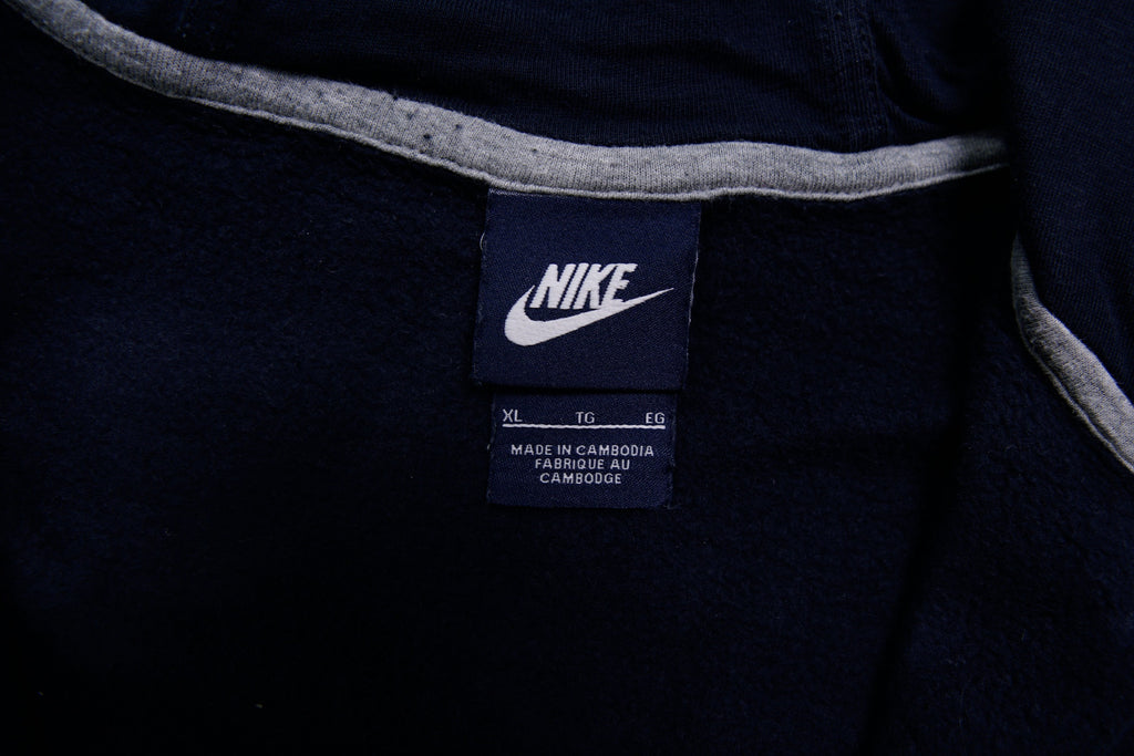 Nike zip hoodie in dark blue with embroidered white Swoosh logo on chest, size label