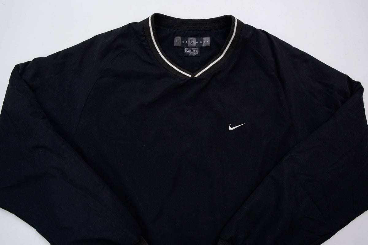 Nike Golf sweater in black with a V-neck collar and a small white embroidered swoosh, full view
