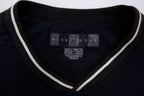 Nike Golf sweater in black with a V-neck collar and a small white embroidered swoosh, size label