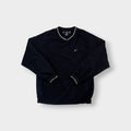 Nike Golf sweater in black with a V-neck collar and a small white embroidered swoosh
