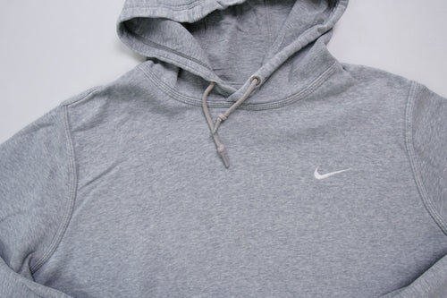 Nike grey hoodie sweater featuring a small white embroidered Swoosh logo on the chest, full view