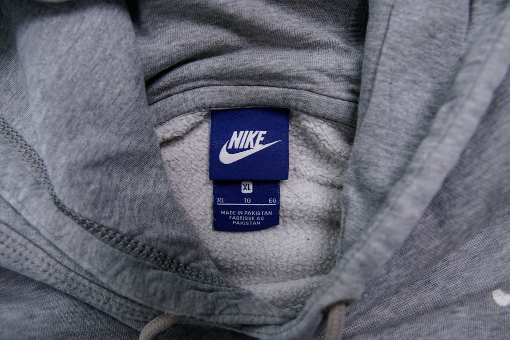 Nike grey hoodie sweater featuring a small white embroidered Swoosh logo on the chest, size label