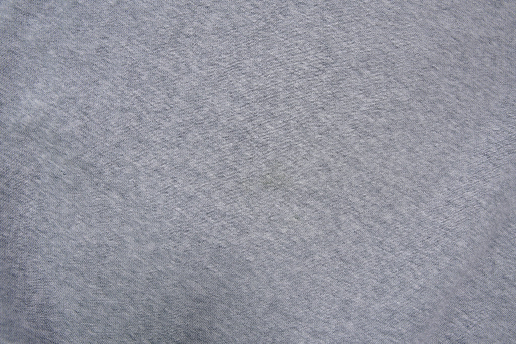 Nike grey hoodie sweater featuring a small white embroidered Swoosh logo on the chest, detail 2
