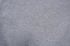 Nike grey hoodie sweater featuring a small white embroidered Swoosh logo on the chest, detail 2