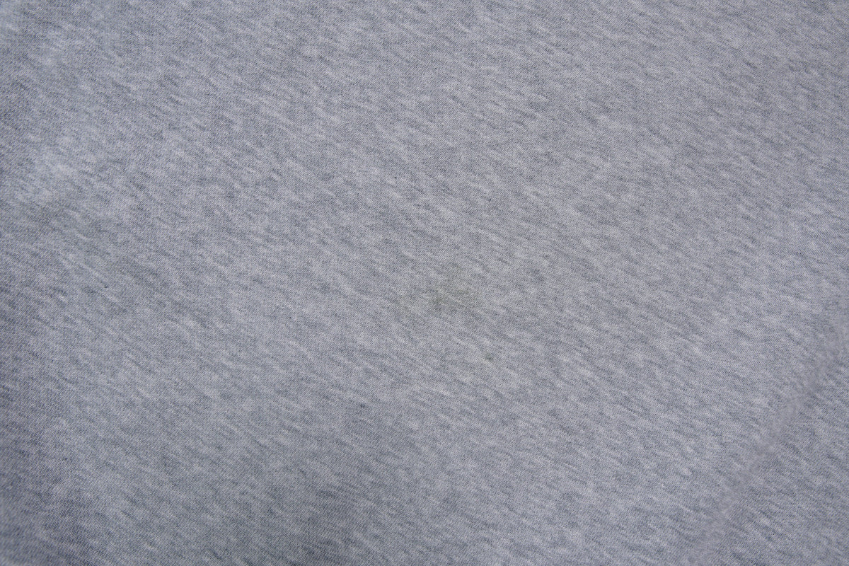 Nike grey hoodie sweater featuring a small white embroidered Swoosh logo on the chest, detail 2