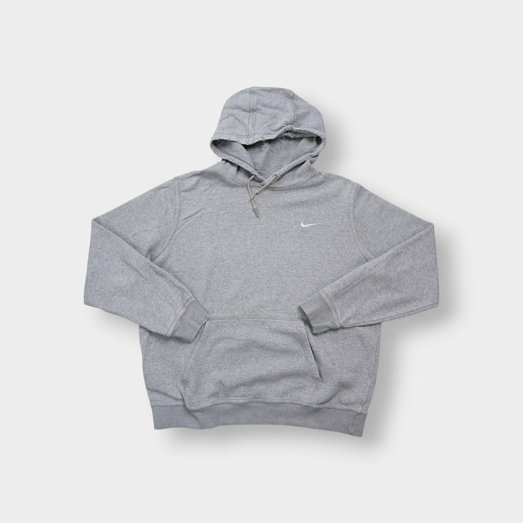 Nike grey hoodie sweater featuring a small white embroidered Swoosh logo on the chest