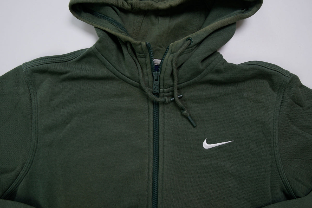 Nike sweater in green featuring an embroidered white Swoosh logo on the chest, detail
