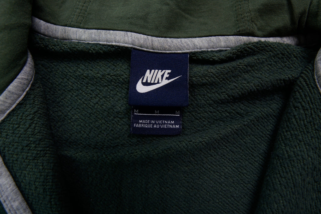 Nike sweater in green featuring an embroidered white Swoosh logo on the chest, size label