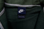 Nike sweater in green featuring an embroidered white Swoosh logo on the chest, size label