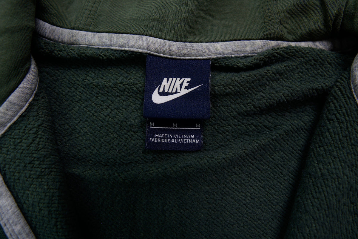 Nike sweater in green featuring an embroidered white Swoosh logo on the chest, size label
