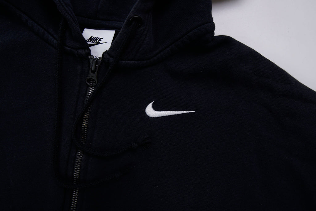 Black Nike zip jacket featuring a hood and embroidered white Swoosh on chest, detail 2